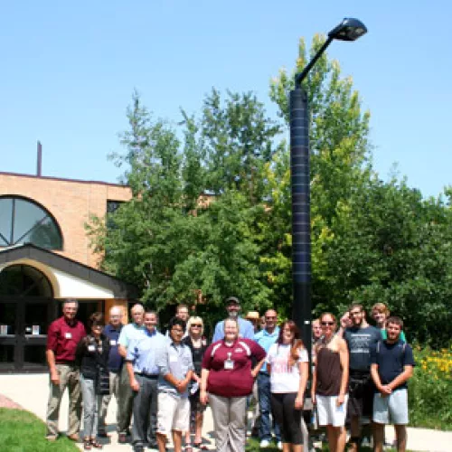 Students, staff, and faculty in the Nature Nook with the new light