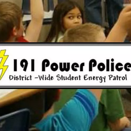 Author Fernando Vasquez teaching young students about vampire power; energy used when electronics are plugged in, but turned off.
