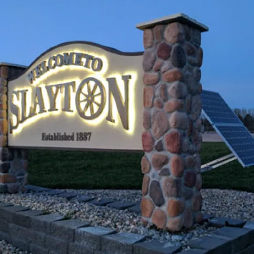 New solar-powered LED lit signs welcome people to Slayton