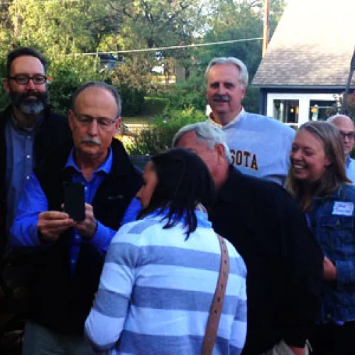Attendees networking at the brewery