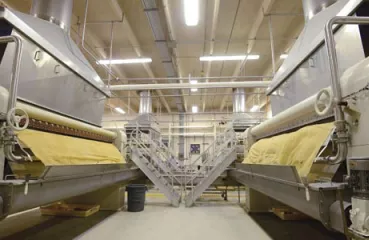 Sheets of honey come off the drum dryers