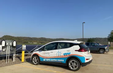 MiEnergy's Chevy Bolt parked at the EV Chargers in their parking lot in Rushford