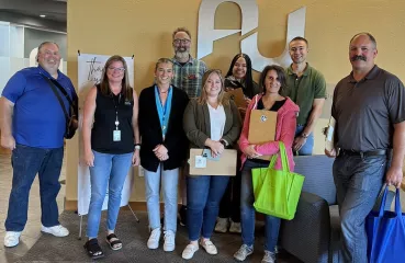 The CERTs crew and Austin Utility employees gather to reach out to local businesses in Austin. 