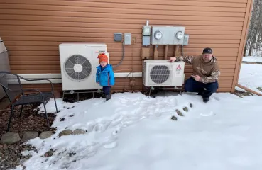 father and son in front of condensers