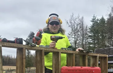 Richard Pierce with power tools outside