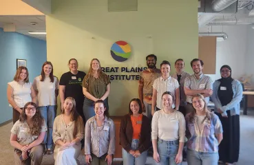Group photo of the cohort in front of the Great Plains Institute sign