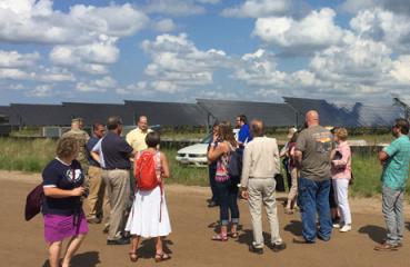 Attendees learn about 10MW solar PV array under construction at Camp Ripley