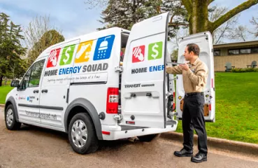 Home Energy Squad truck and worker