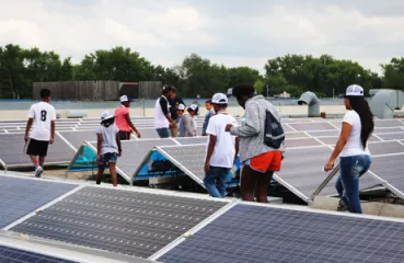 Students tour solar panels with Just-B-Solar Camp, part of Just Community Solar Coalition's effort to educate youth
