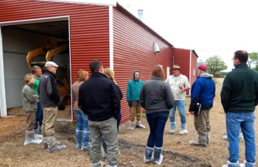 Touring the biomass-heated poultry barn at Viking Company