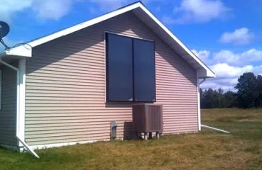 house with solar thermal panels