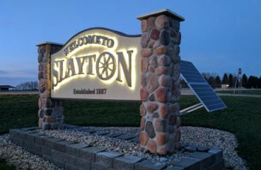 New solar-powered LED lit signs welcome people to Slayton