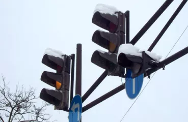 Snow sits on traffic lights in the winter