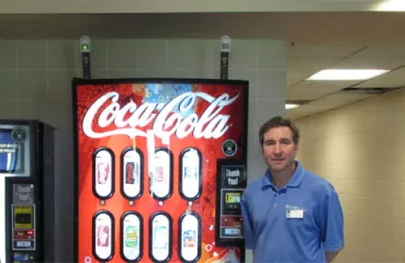Bill McCann, site manager at Hillcrest recreation center, with the VendingMisers