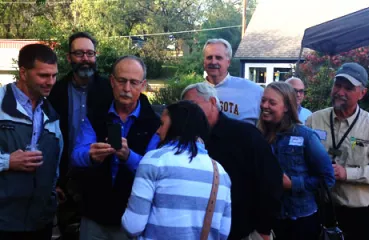 Attendees networking at the brewery