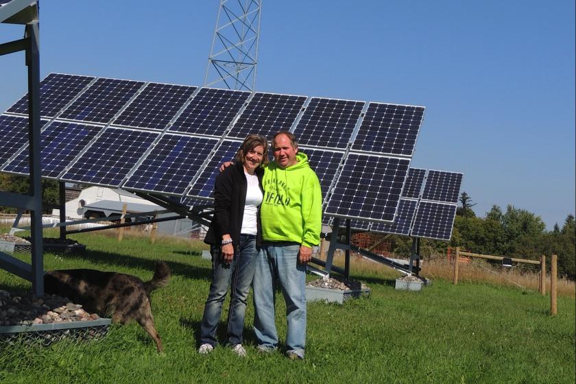 Doug & Jane with solar, wind & dog