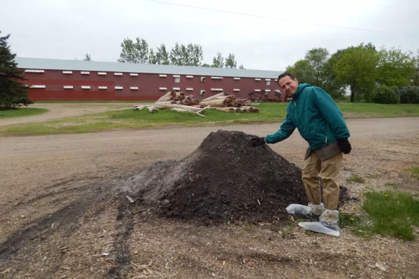 This photo shows the relatively small pile of ash resulting from burning seven semi-truck loads of biomass in the furnace at Viking Company in Albany, MN.