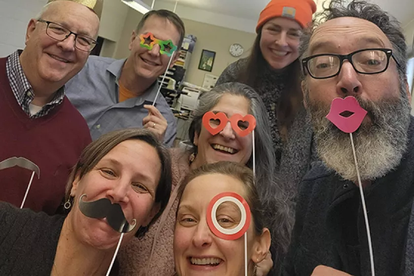 CERTs staff with photo booth props