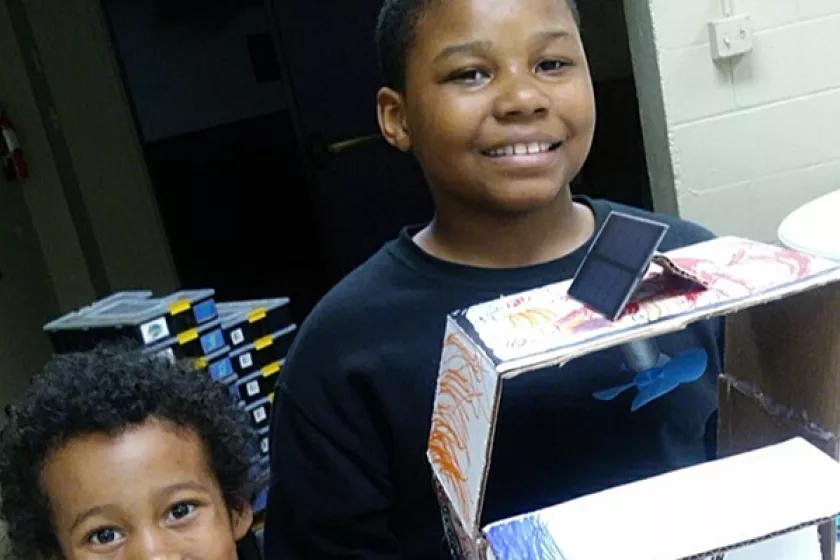 kids holding solar model