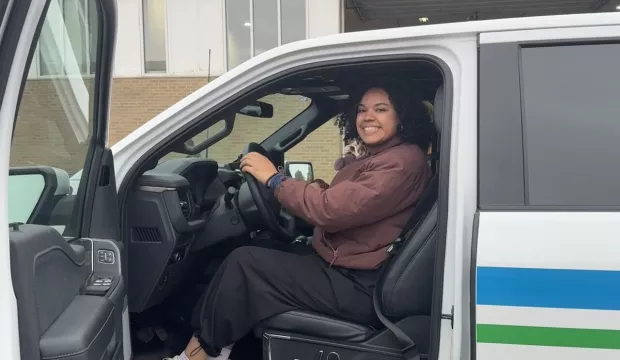 Imani driving an electric truck