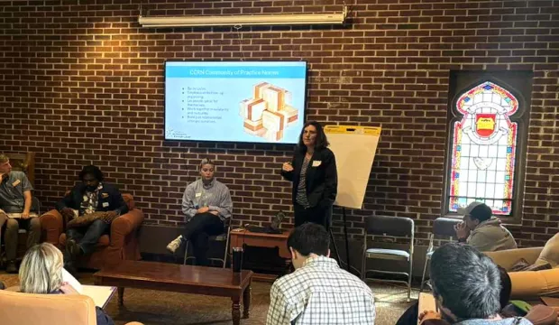 MNIPL’s Julia Nerbonne speaks with the cohort, providing coaching and support.