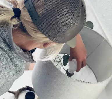 Person replacing light bulb