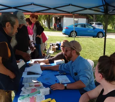 people at event table outside