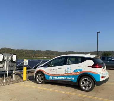 MiEnergy's Chevy Bolt parked at the EV Chargers in their parking lot in Rushford