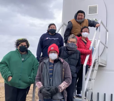 ISLe students visiting an outdoors clean energy site