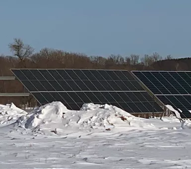 Solar array surrounded by snow