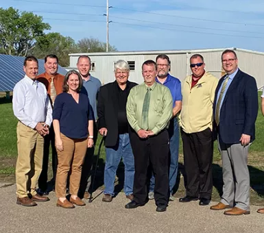 School board and reps with solar array