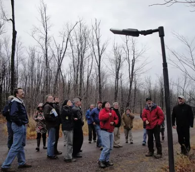 group looking at led lights