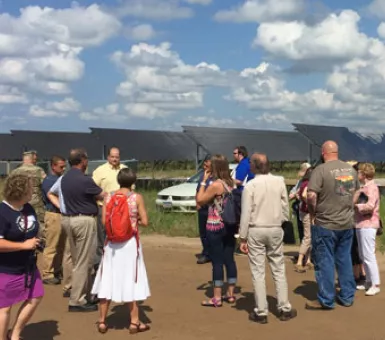 Attendees learn about 10MW solar PV array under construction at Camp Ripley