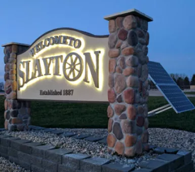New solar-powered LED lit signs welcome people to Slayton