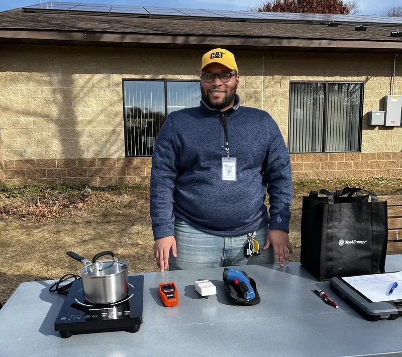 Caption: Robert Harris participating in an outreach event at River Bend Nature Center